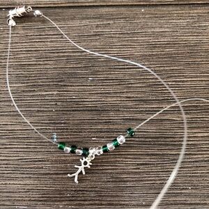 Green and clear beaded floating necklace